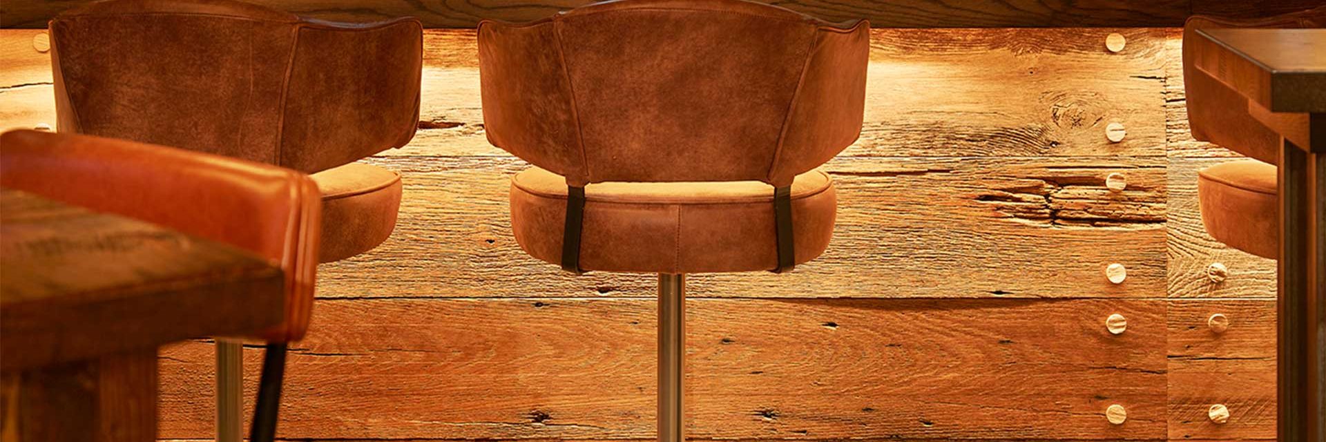 brown bar stool with metal base